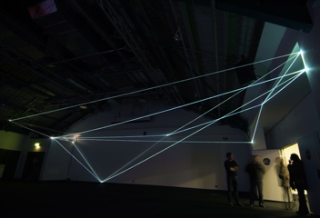 Carlo Bernardini, Drawing of the Vacuum 2011, installazione in fibre ottiche, mt h 5x20x10; Kinetica Art Fair, Prewiew - The Arc Show, Business Design Centre, London.