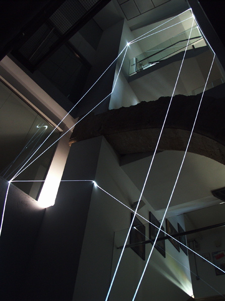 CARLO BERNARDINI, PERMEABLE SPACE 2008; Fiber optic installation, feet h 44x11x9. Valencia, La Nau - Universidad de Valencia.