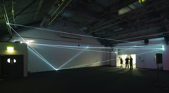 Carlo Bernardini, Drawing of the Vacuum 2011, installazione in fibre ottiche, mt h 5x20x10. Kinetica Art Fair, Prewiew - The Arc Show, Business Design Centre, London.