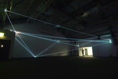 Carlo Bernardini, Drawing of the Vacuum 2011; installazione in fibre ottiche, mt h 5x20x10. Kinetica Art Fair, Prewiew - The Arc Show, Business Design Centre, London.